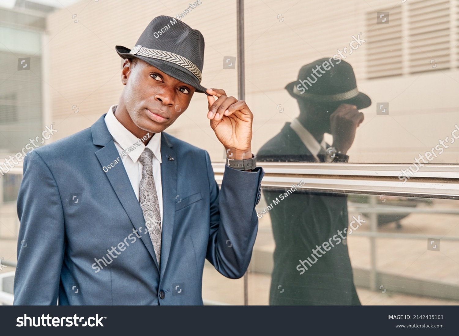 black man in suit and hat