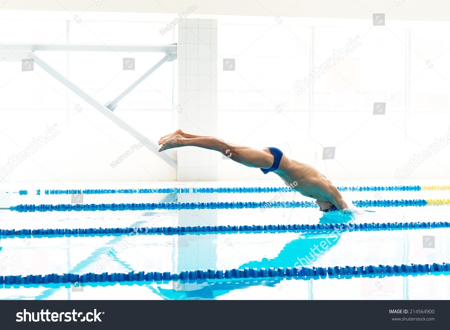 Young Muscular Swimmer Jumping Starting Block Stock Photo 214564900 ...