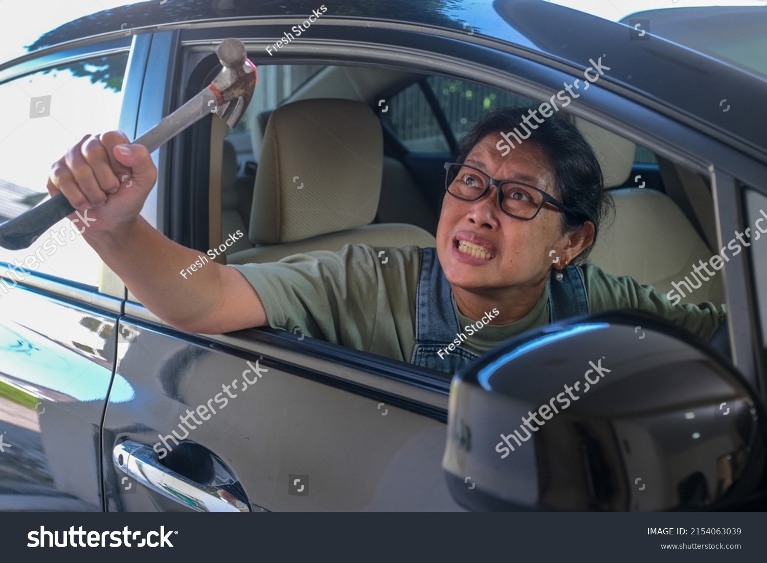 Angry Female Driver Pulling Out Hammer Stock Photo 2154063039 ...