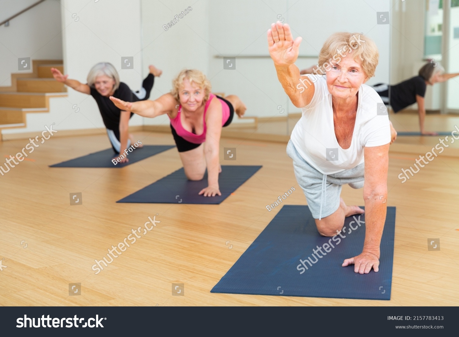 Mature Women Exercising Hands Knees Balance Stock Photo 2157783413 ...