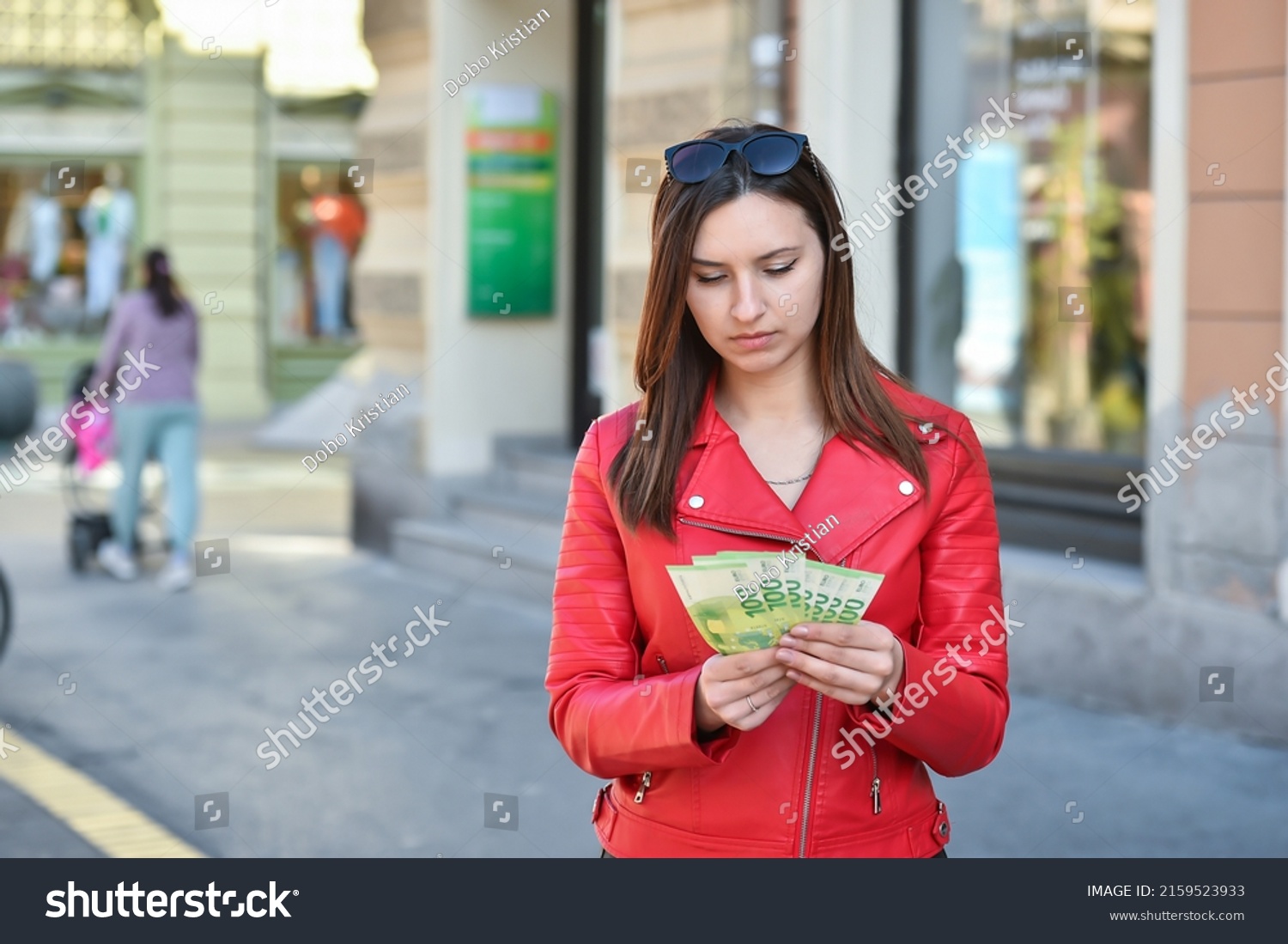 Young Woman Counting Hundred Euro Banknotes Stock Photo 2159523933