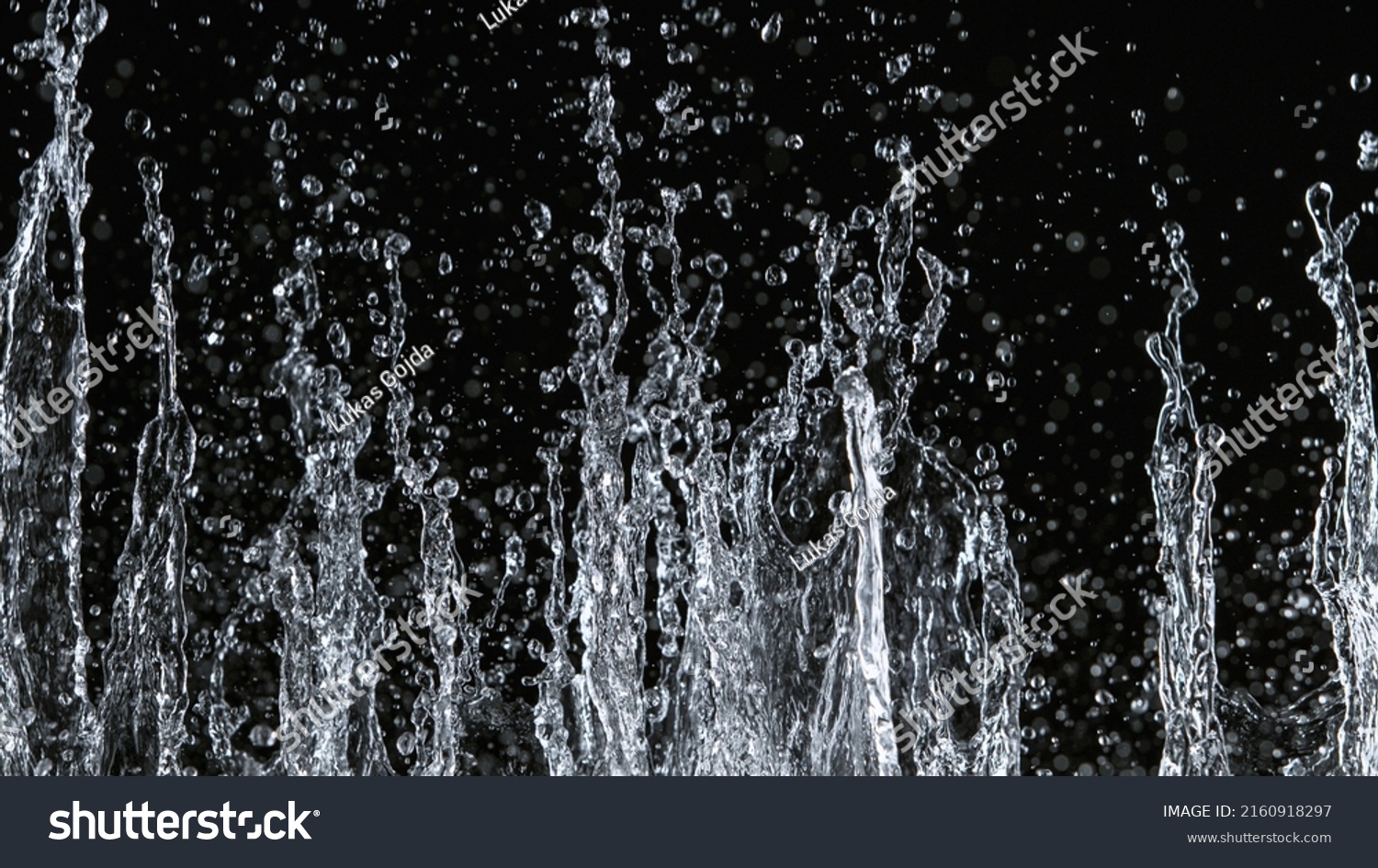 Freeze Motion Water Splash On Black Stock Photo 2160918297 | Shutterstock