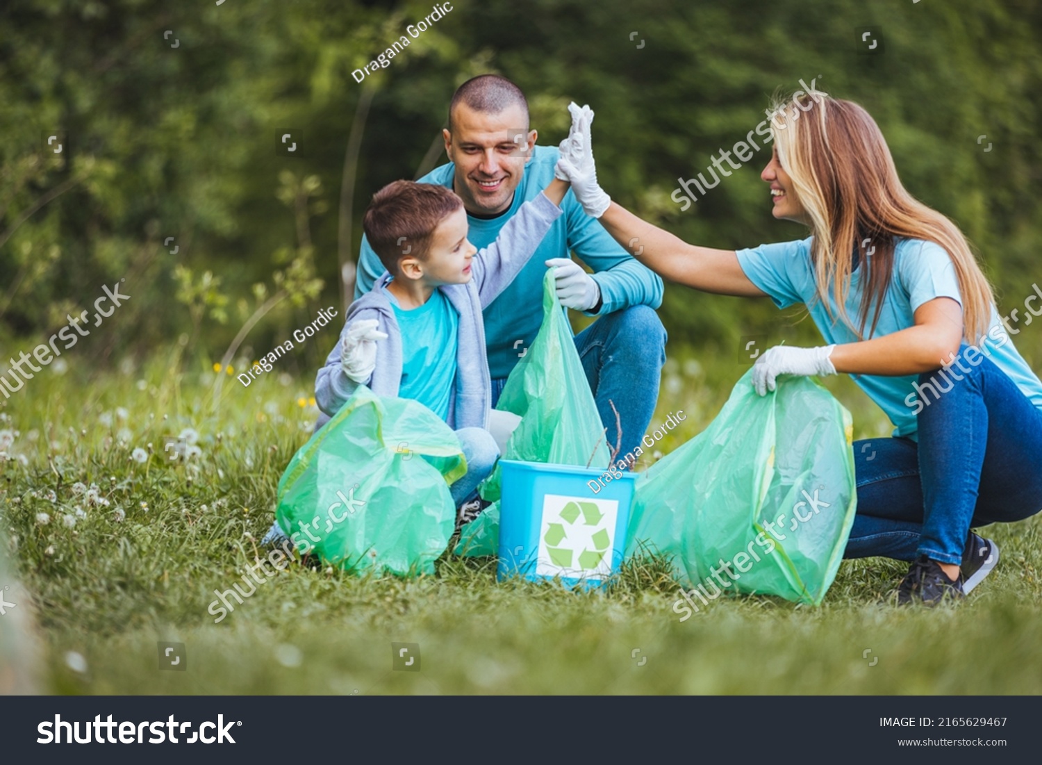 mother-father-child-collect-garbage-clean-stock-photo-2165629467