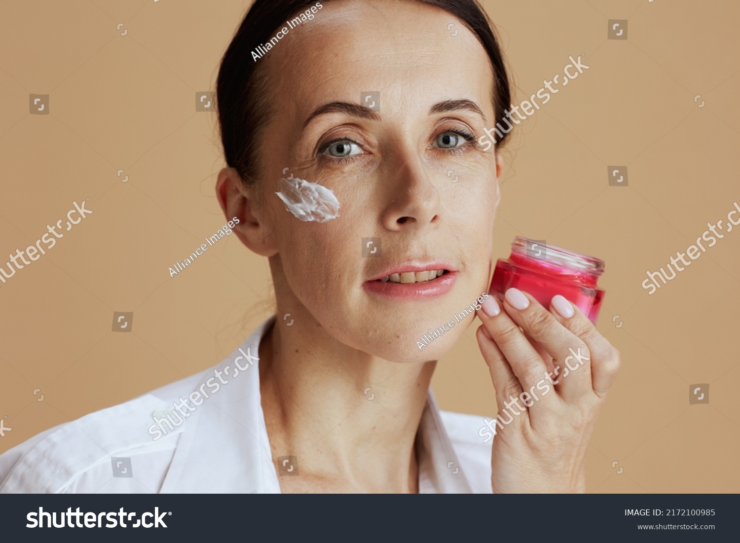 Modern Female Facial Cream Jar White Stock Photo 2172100985 Shutterstock   Stock Photo Modern Female With Facial Cream Jar In White Shirt Isolated On Beige Background 2172100985 