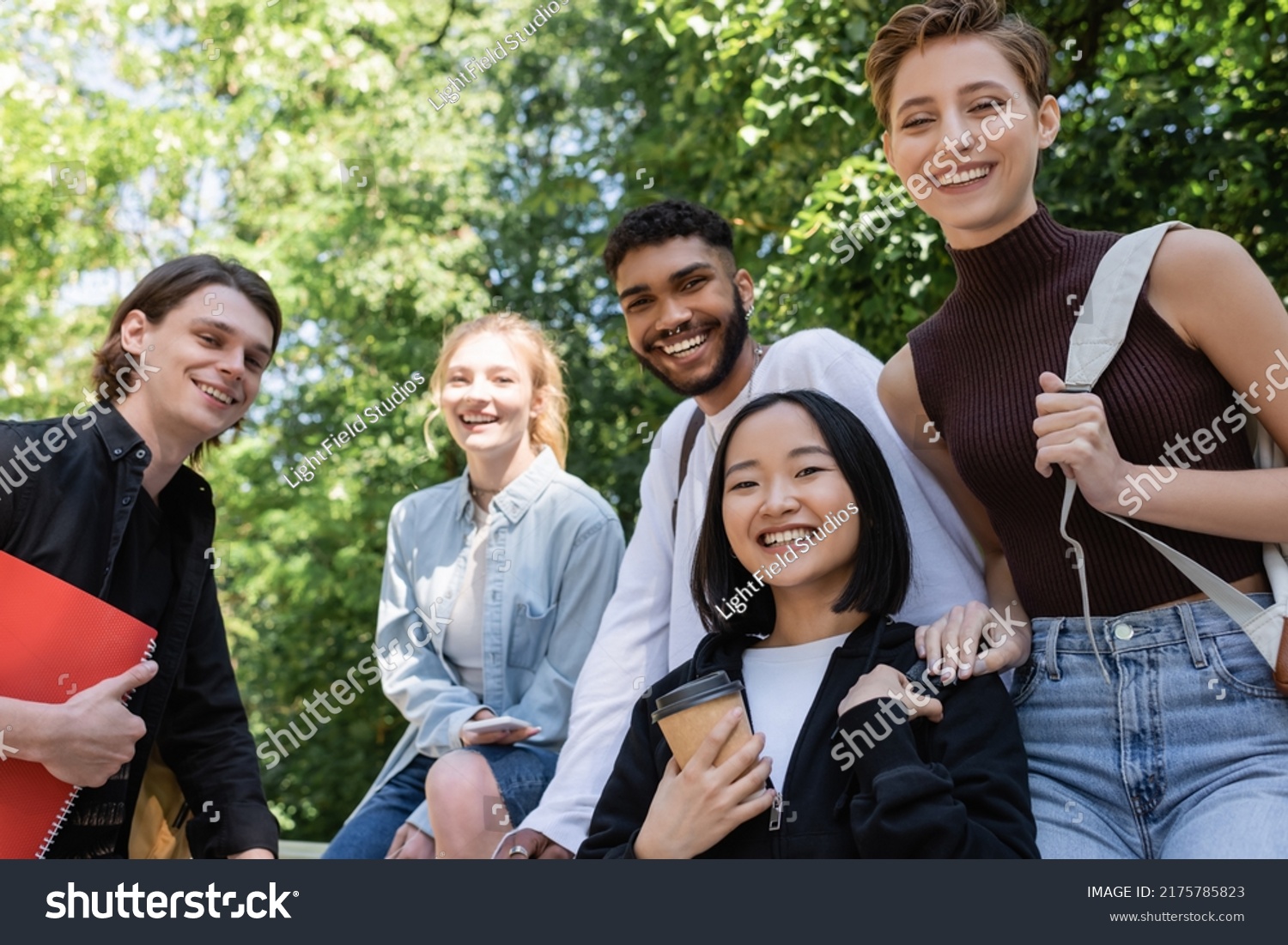 Cheerful Multicultural Students Looking Camera While Stock Photo ...