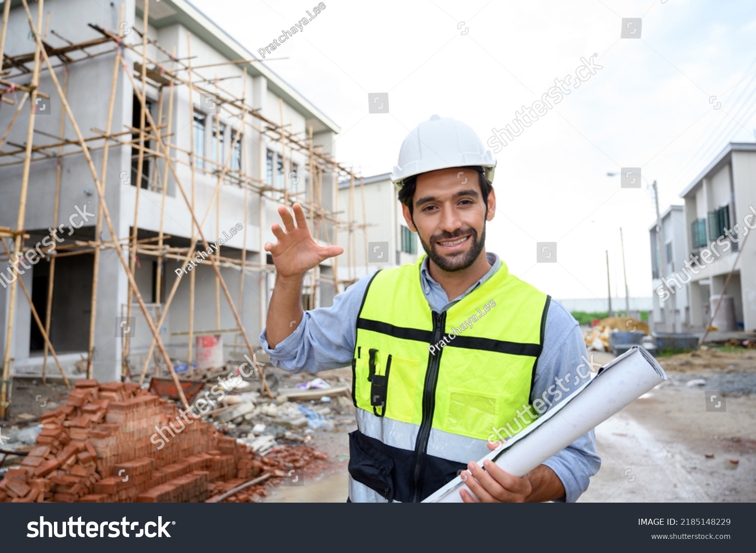 Engineer Man Smiling Holding Blueprint While Stock Photo 2185148229 ...