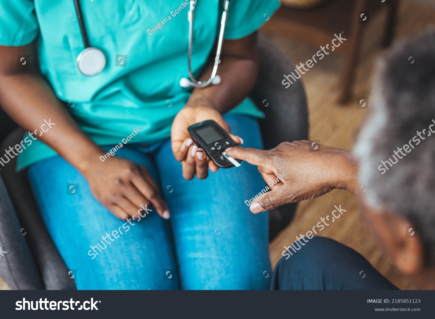 young-nurse-doing-glucose-blood-test-stock-photo-2185851123-shutterstock