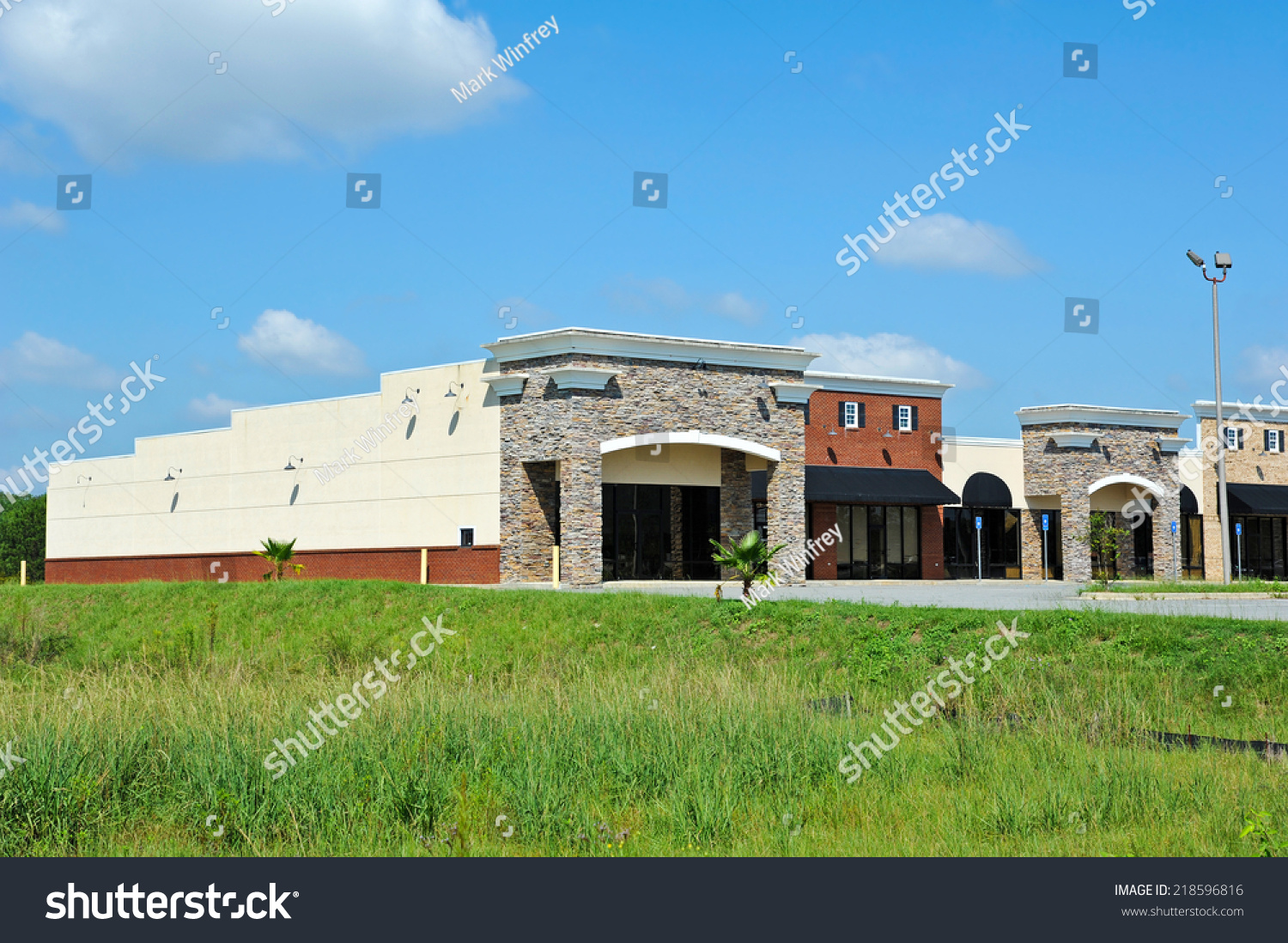 New Commercial Building Retail Office Space Stock Photo 218596816   Stock Photo New Commercial Building With Retail And Office Space Available For Sale Or Lease 218596816 