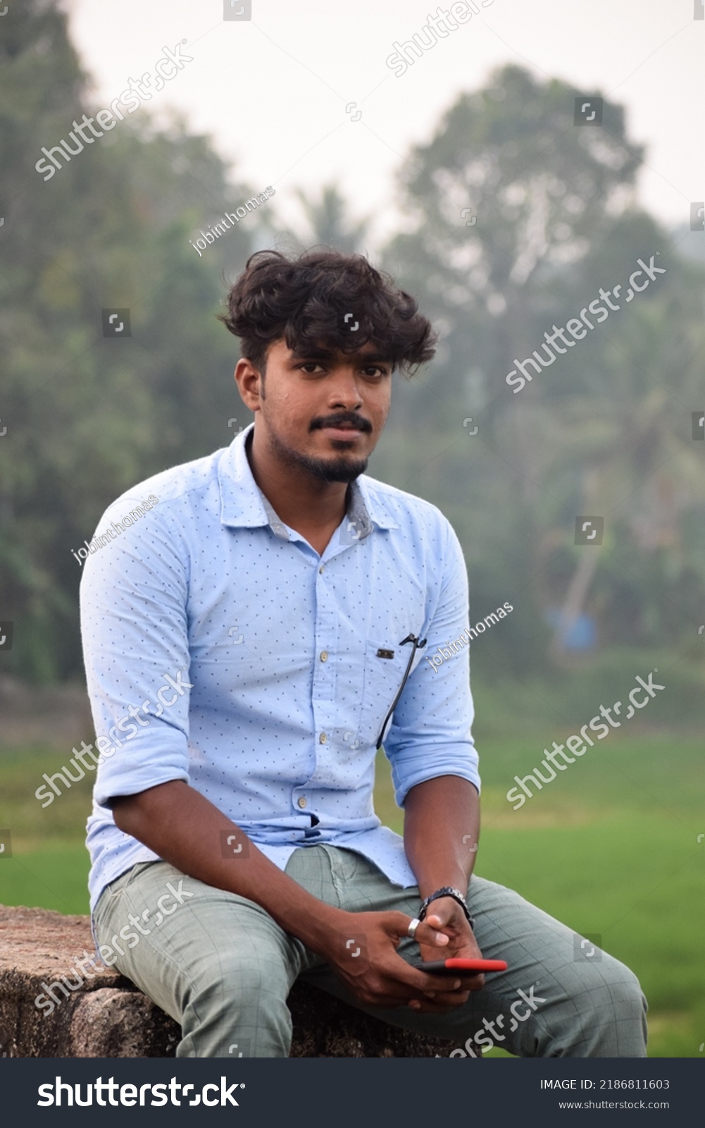 Indian Boy Sitting On Cement Bench Stock Photo 2186811603 | Shutterstock