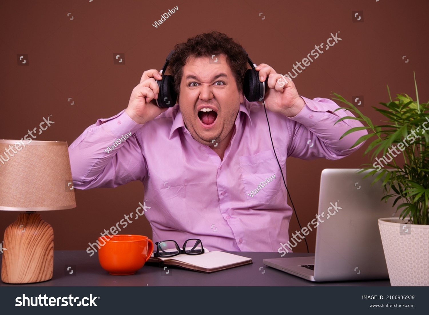 funny-fat-man-watching-scary-movie-stock-photo-2186936939-shutterstock