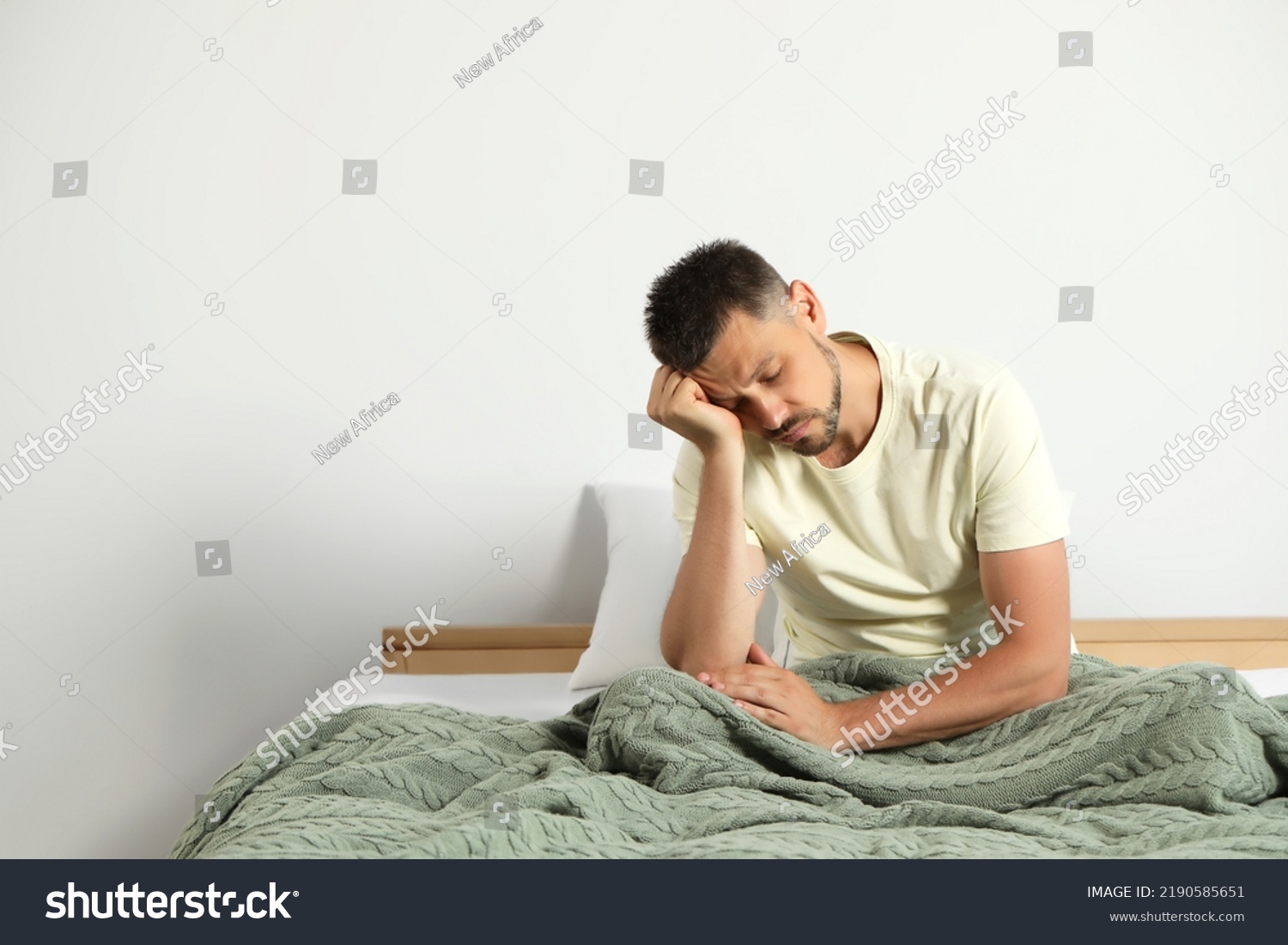 Sleep Deprived Man Sitting On Bed Stock Photo 2190585651 | Shutterstock