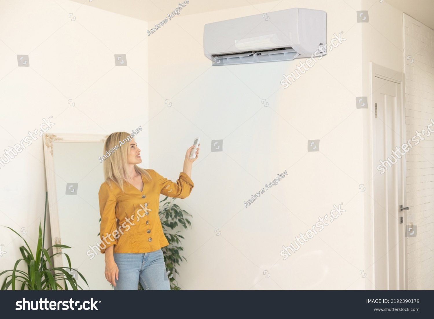 Air Conditioner Inside Room Woman Operating Stock Photo 2192390179 ...