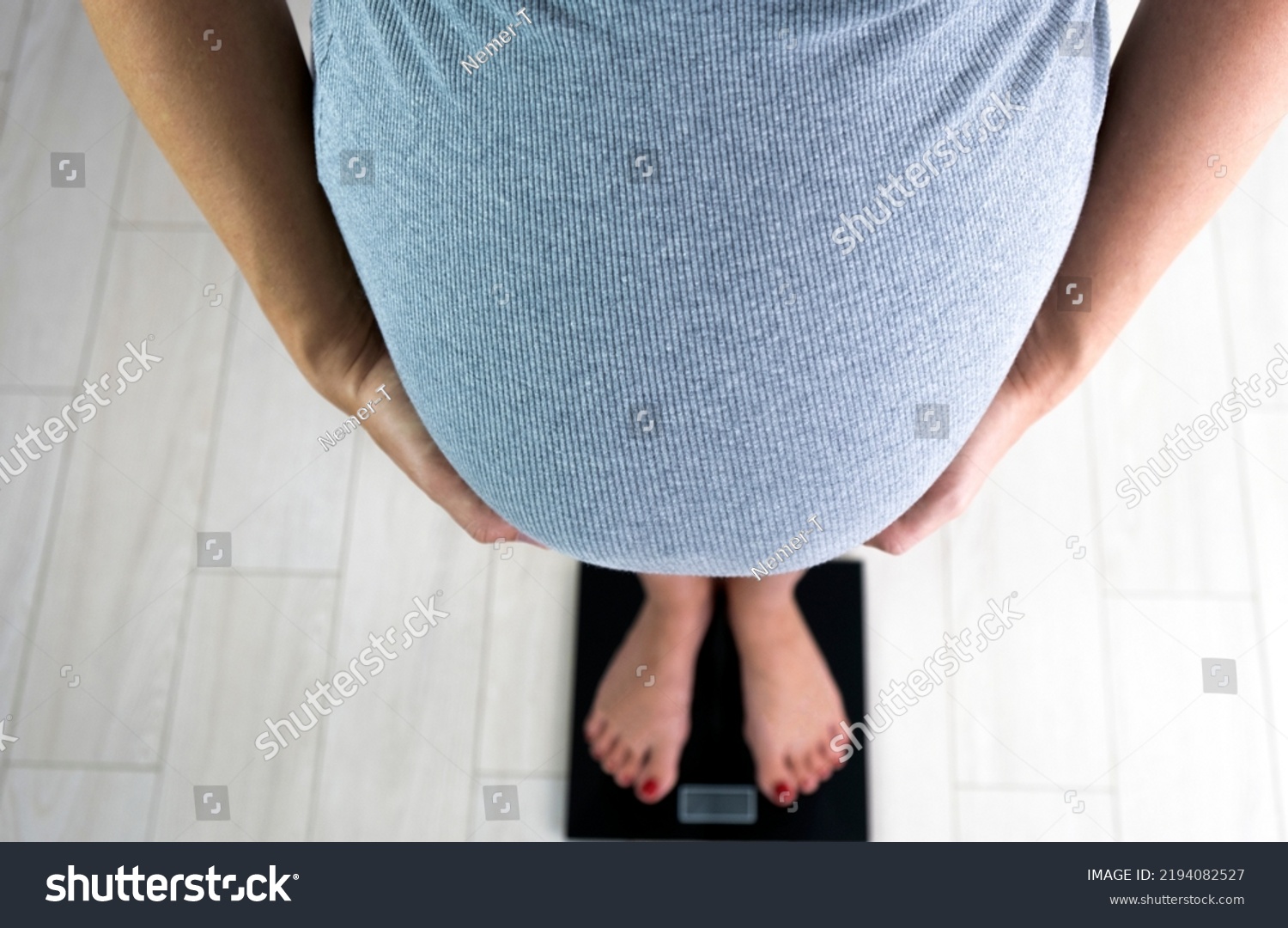 Pregnant Woman Barefoot On Scales Control Stock Photo 2194082527   Stock Photo Pregnant Woman With Barefoot On Scales Control Her Weight Gain Healthy Pregnancy 2194082527 