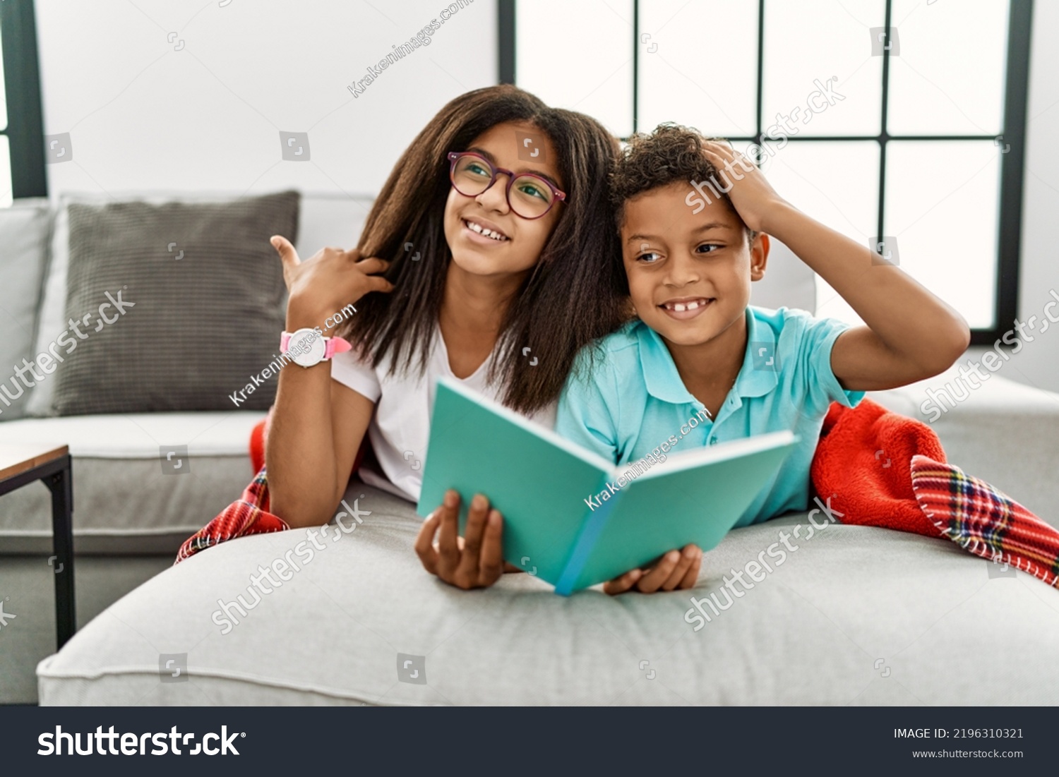 Two Siblings Lying On Sofa Reading Stock Photo 2196310321 | Shutterstock