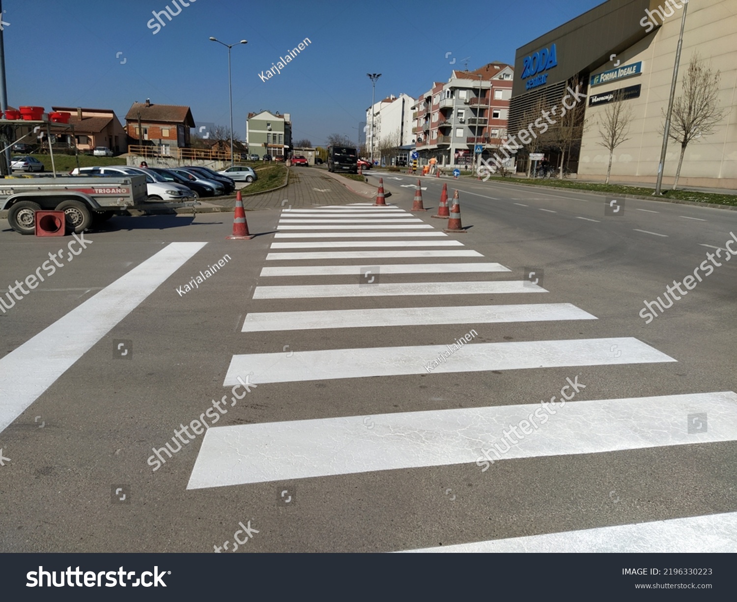 Painting Pedestrian Crossings New Paint Road Stock Photo 2196330223   Stock Photo Painting Pedestrian Crossings With New Paint Road Warning Plastic Orange Cone Street With Houses 2196330223 