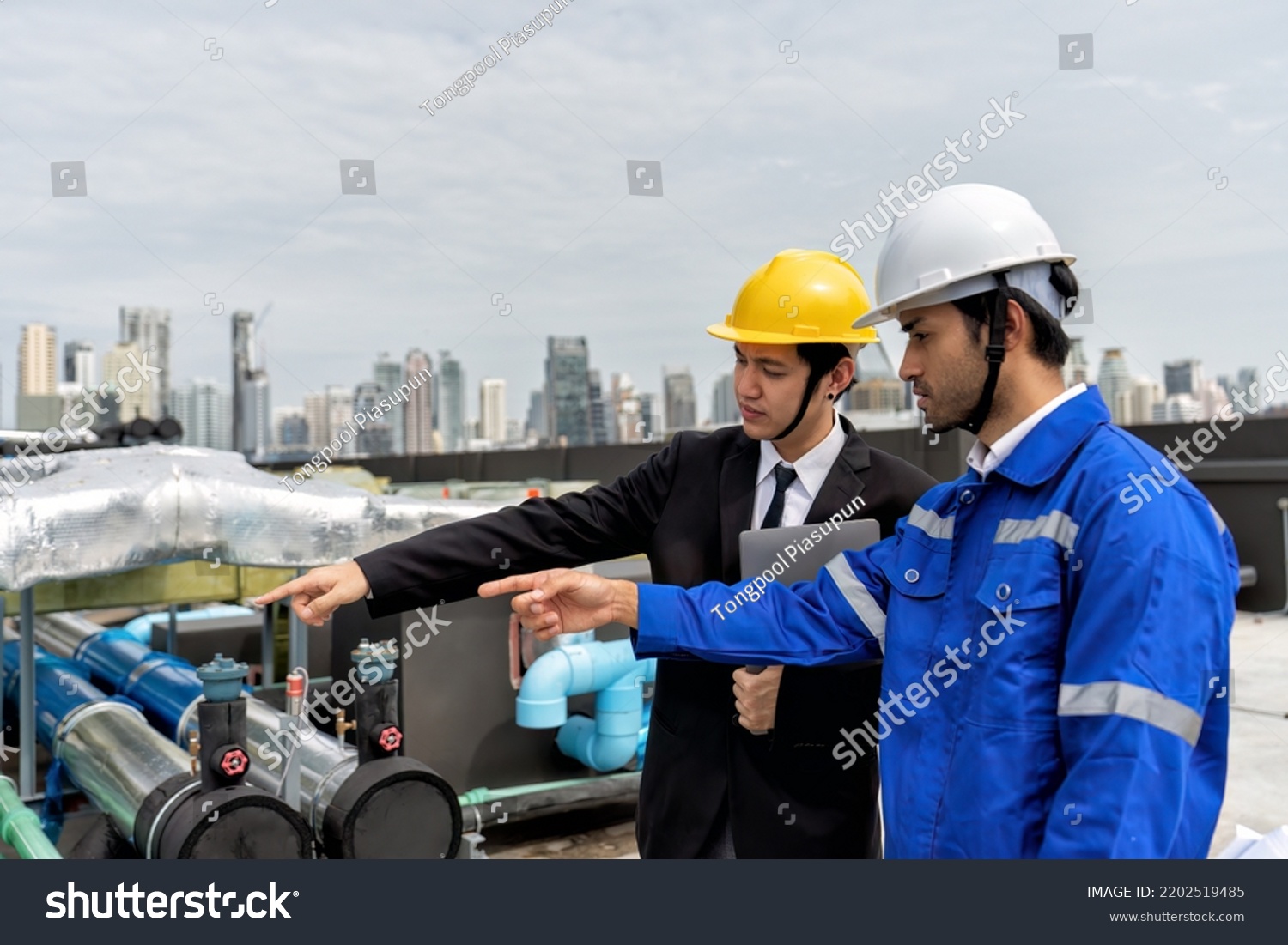 construction-site-manager-visit-engineer-working-stock-photo-2202519485