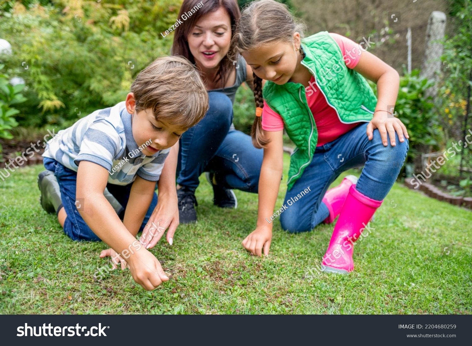 Mom Her Children Seeding Grass Their Stock Photo 2204680259 | Shutterstock