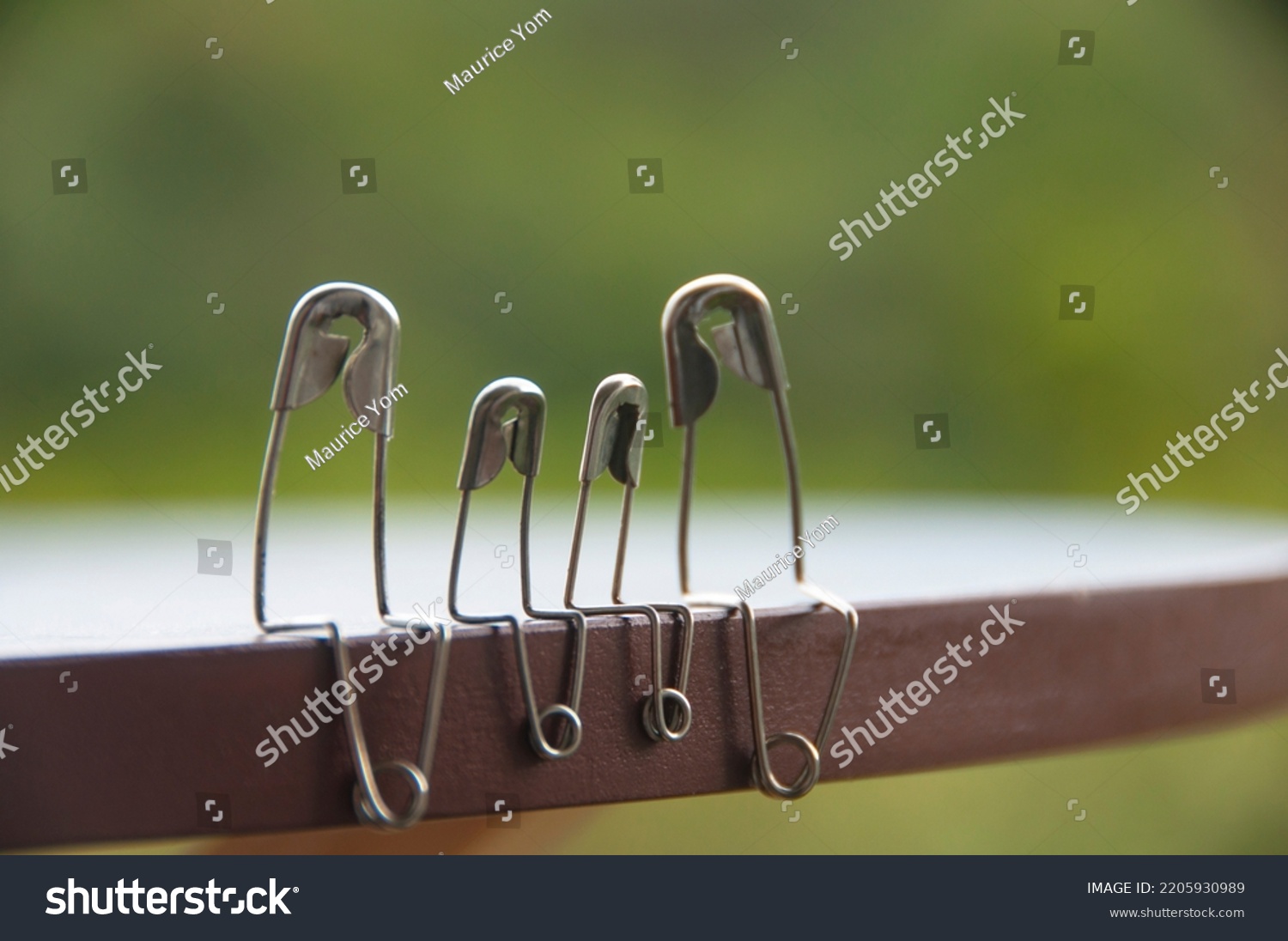 Model Safety Pin Family Sitting On Stock Photo 2205930989 | Shutterstock