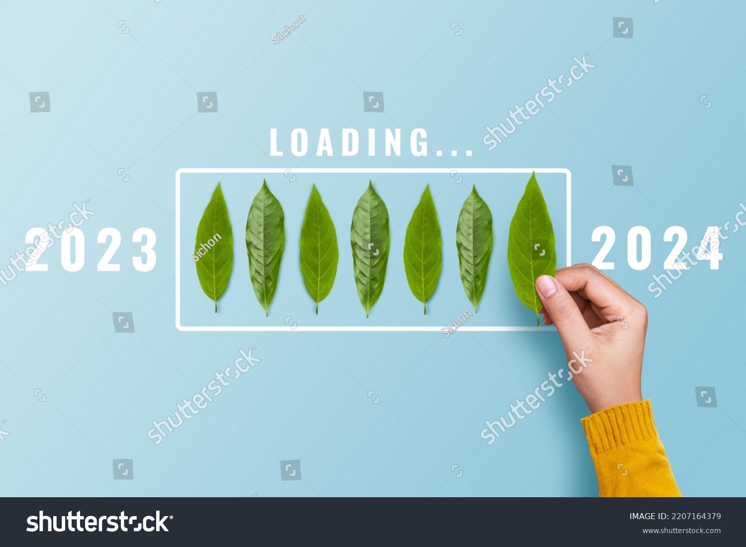 Hand Putting Leaf Countdown 2024 Loading Stock Photo 2207164379   Stock Photo Hand Putting Leaf For Countdown To Loading Year To Start Concept 2207164379 