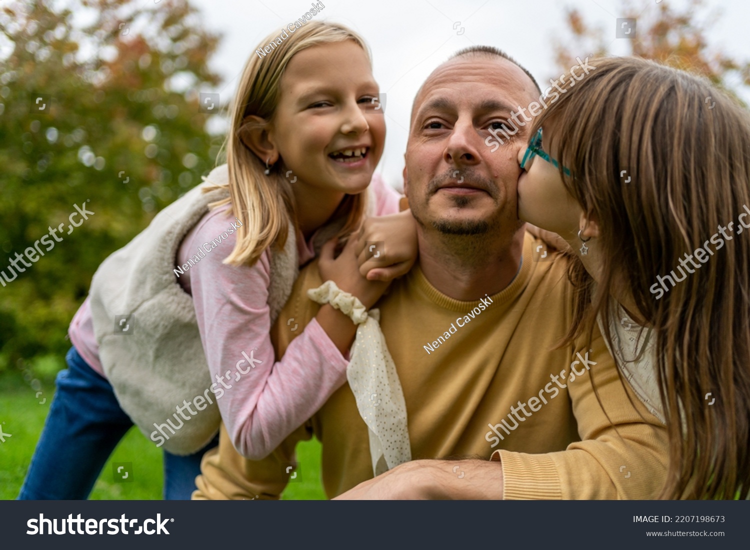 Portrait Little Girls Kissing Their Dad Stock Photo 2207198673 ...