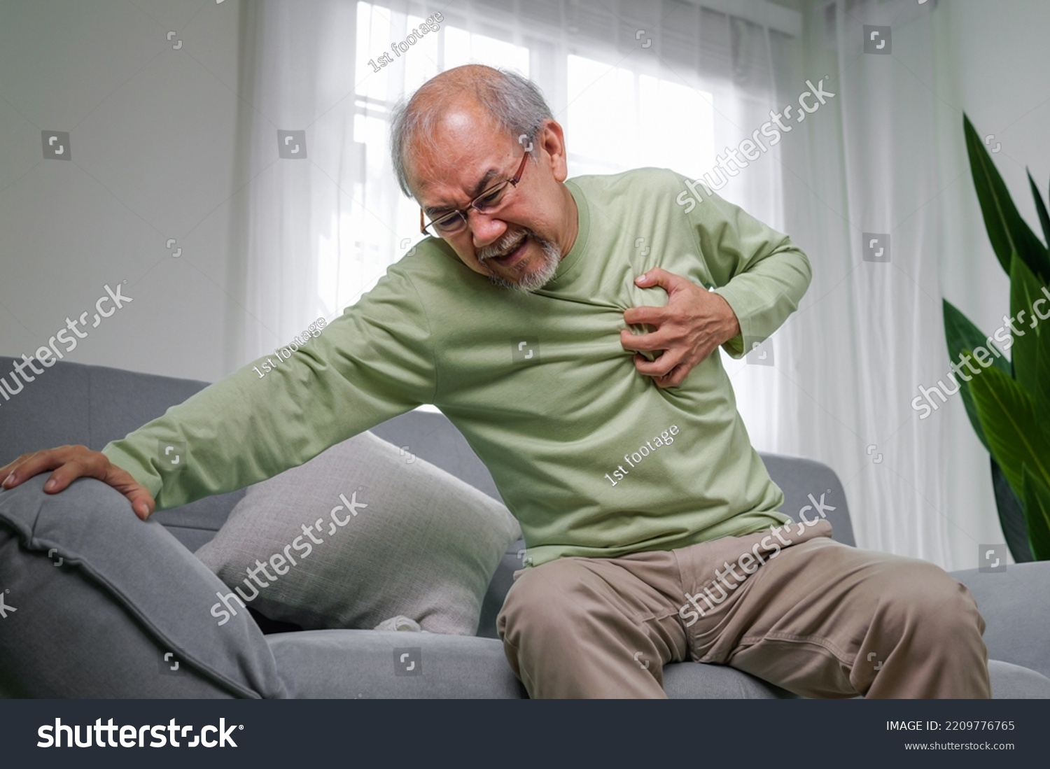 heart-attack-symptoms-senior-heart-attack-stock-photo-2209776765