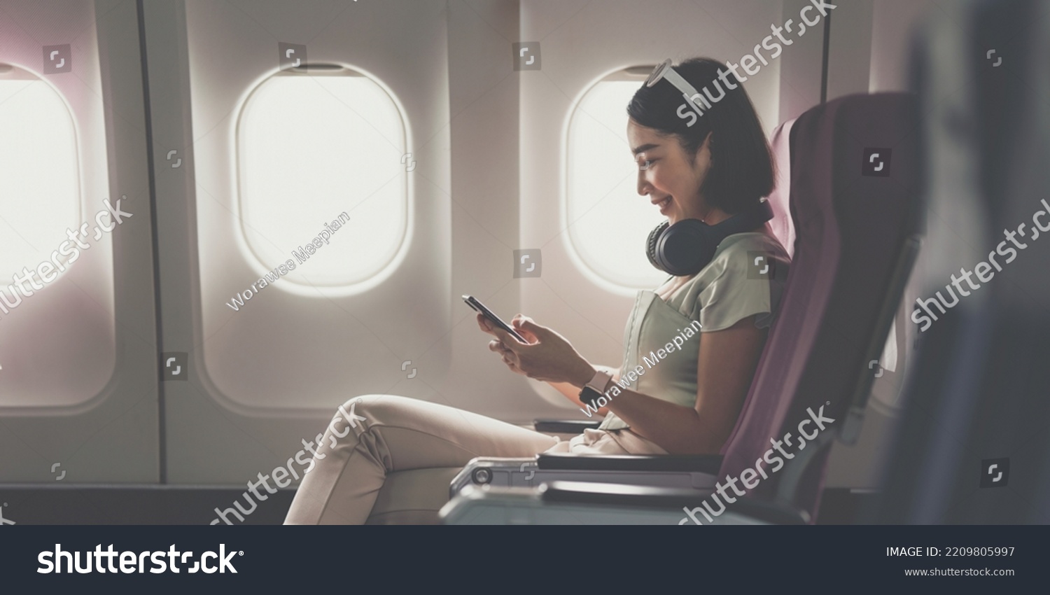 Joyful Asian Woman Sits Airplane Using Stock Photo 2209805997 ...