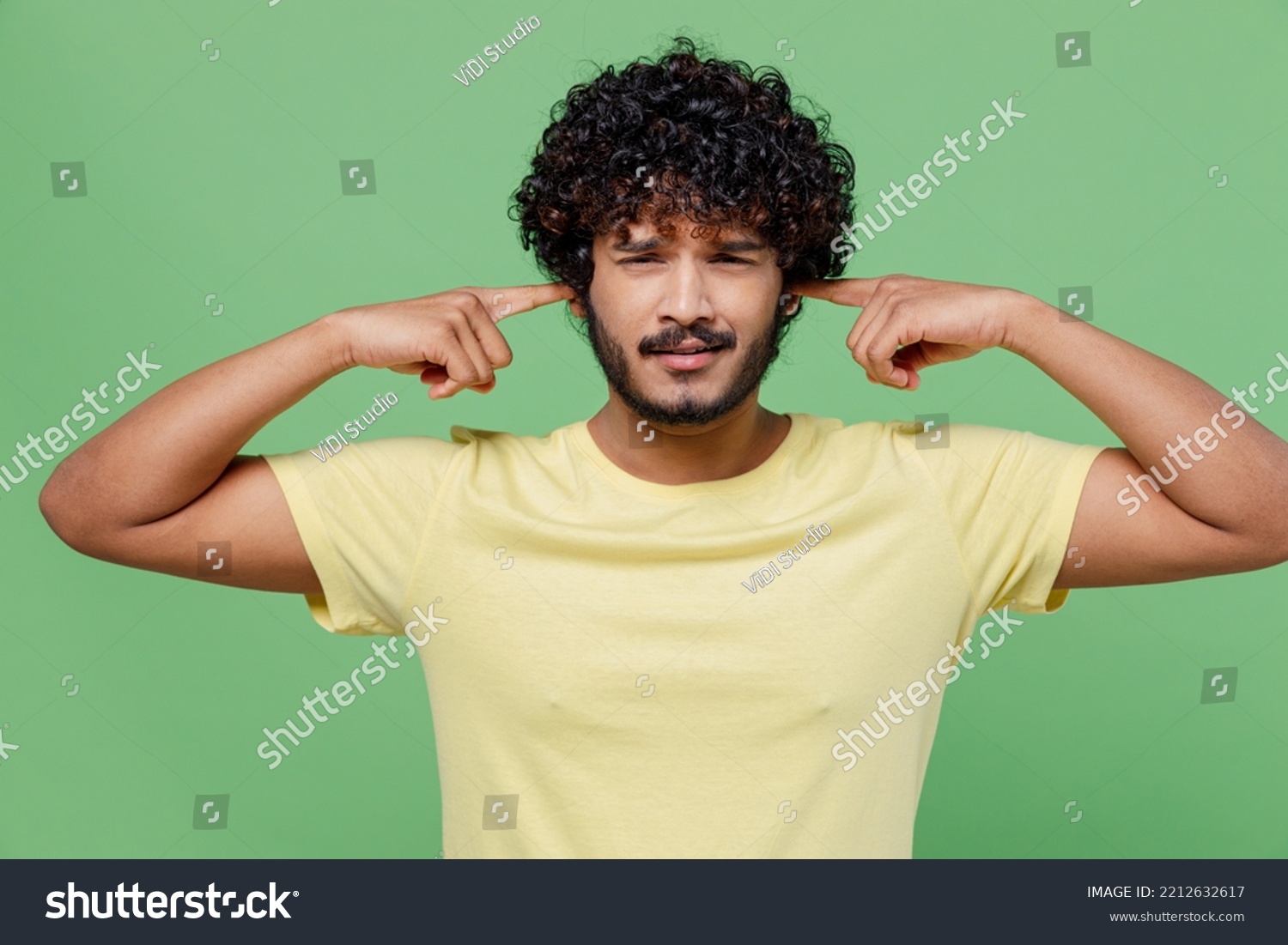 Young Sad Indian Man 20s Basic Stock Photo 2212632617 Shutterstock   Stock Photo Young Sad Indian Man S In Basic Yellow T Shirt Cover Ears With Hands Fingers Do Not Want To 2212632617 