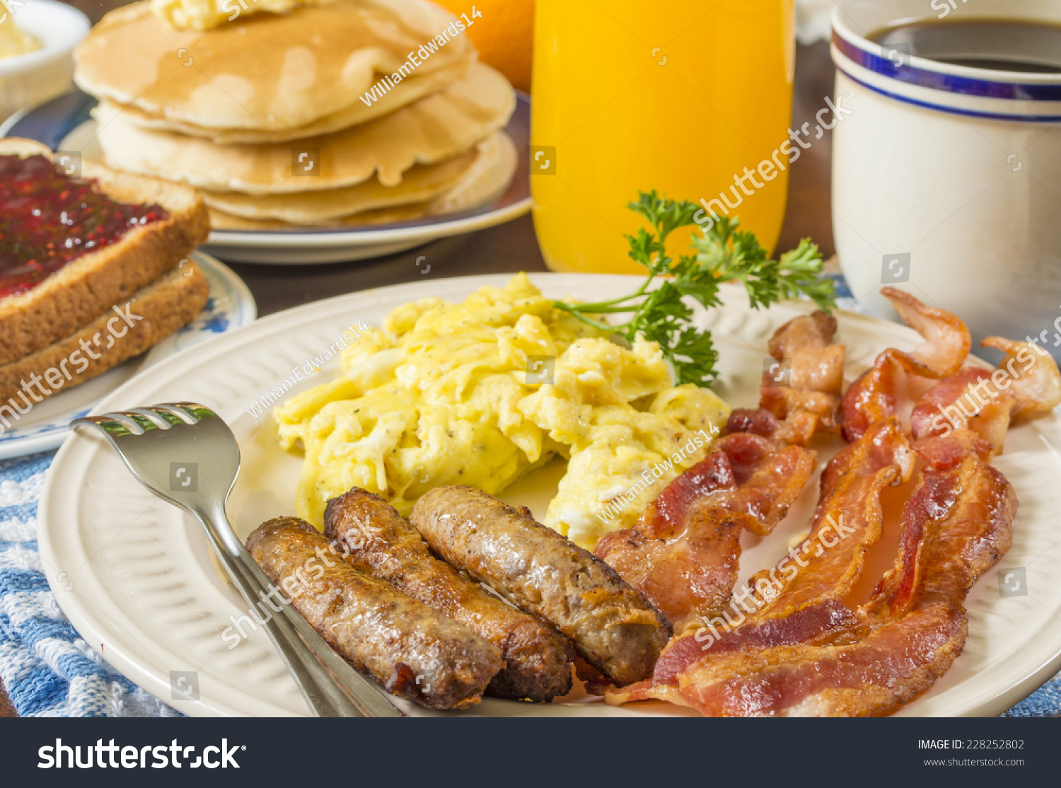 scrambled eggs and bacon and sausage