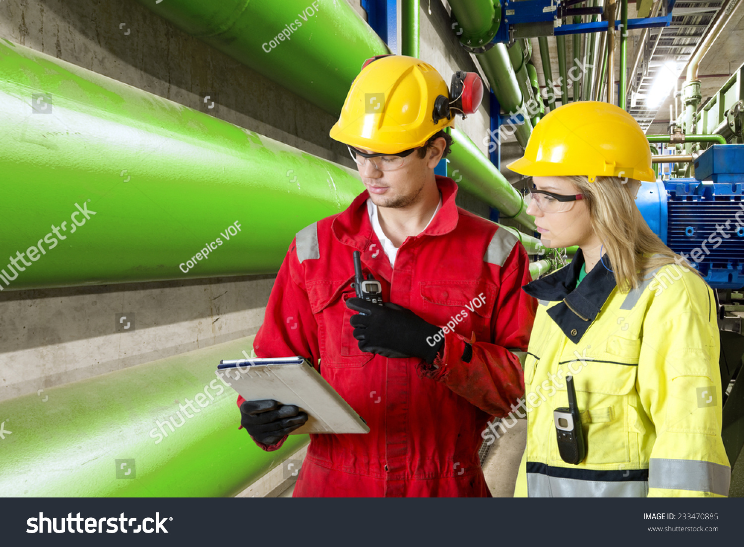 Two Maintenance Engineers Going Through Checklist Stock Photo 233470885   Stock Photo Two Maintenance Engineers Going Through A Checklist During A Routine Inspection Of An Industrial 233470885 