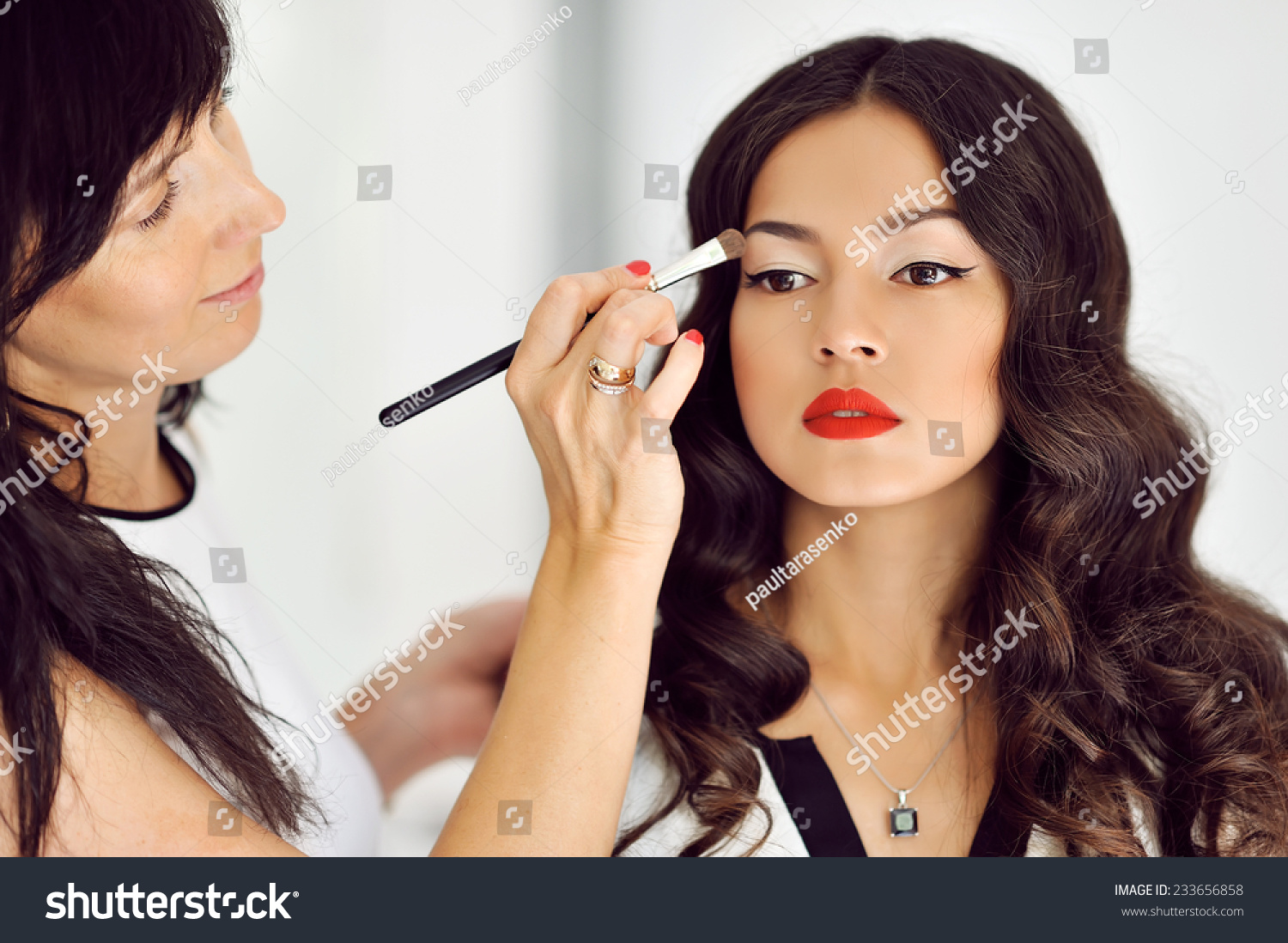 Young Beautiful Asian Woman Applying
