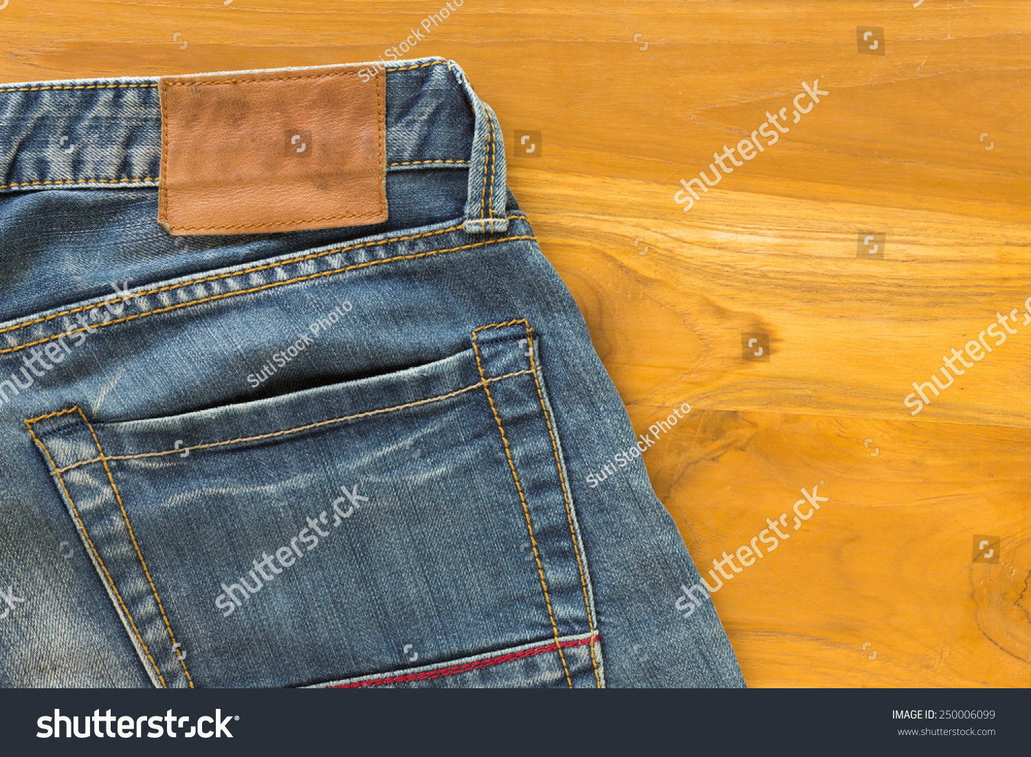 jeans with brown tag on back pocket