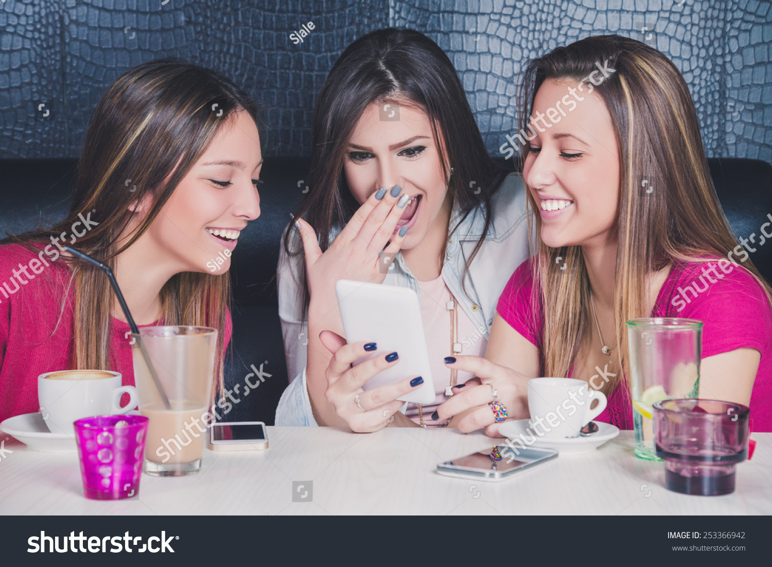 Three Young Girls Laughing While Looking Stock Photo 253366942 ...