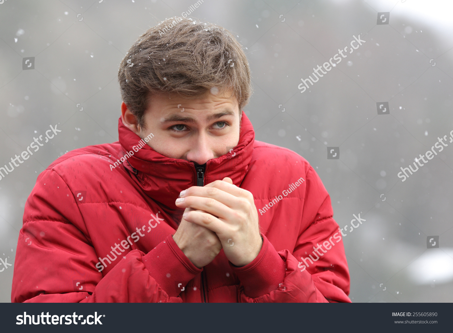 man-shivering-cold-winter-rubbing-hands-stock-photo-255605890