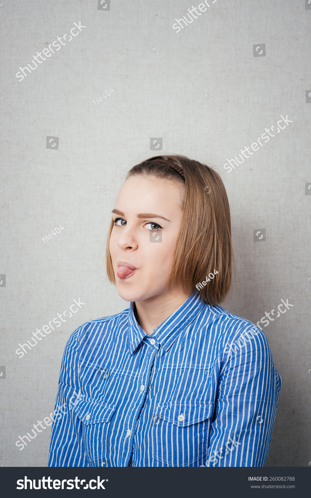 girl-sticking-her-tongue-out-stock-photo-260082788-shutterstock