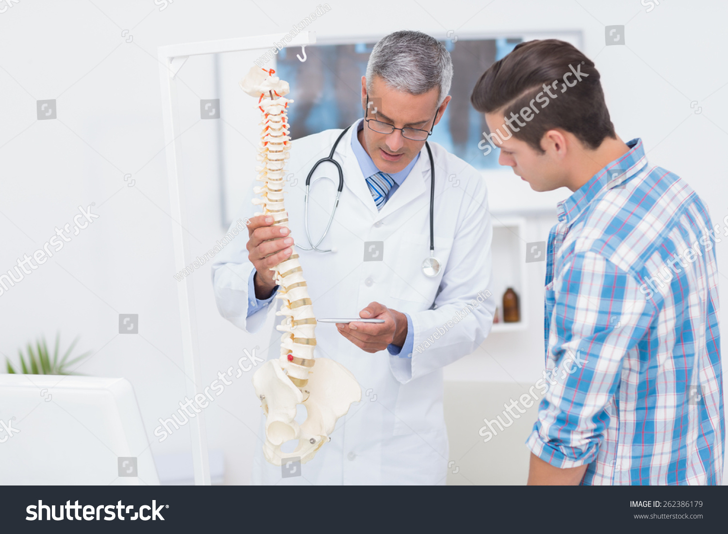 Doctor Explaining Spine His Patient Medical Stock Photo 262386179 ...