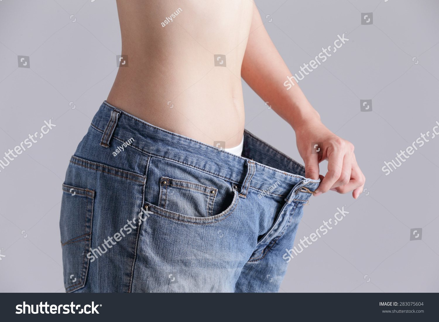 Woman Shows Weight Loss By Wearing Stock Photo 283075604 Shutterstock