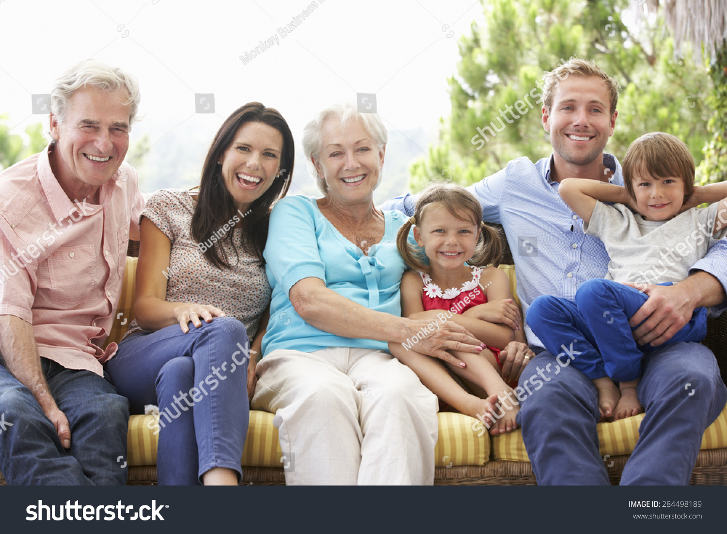 Multi Generation Family Sitting On Garden Stock Photo 284498189 ...