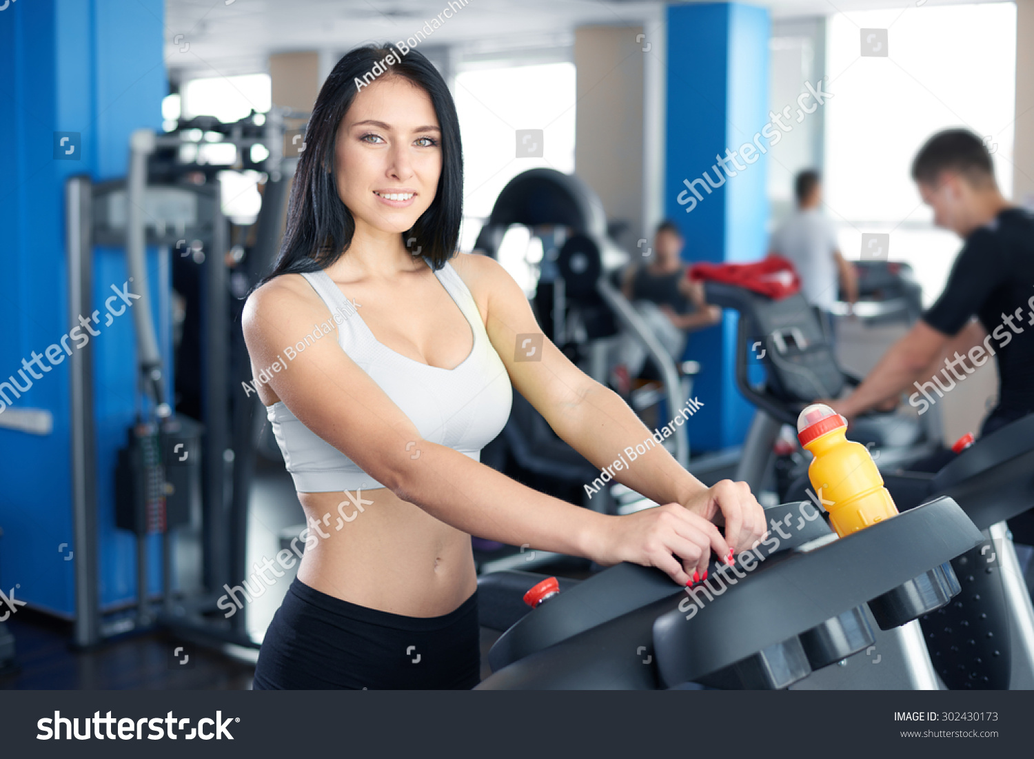 Стоковая фотография 302430173 Young Sexy Lady Running On Treadmill Shutterstock 1179