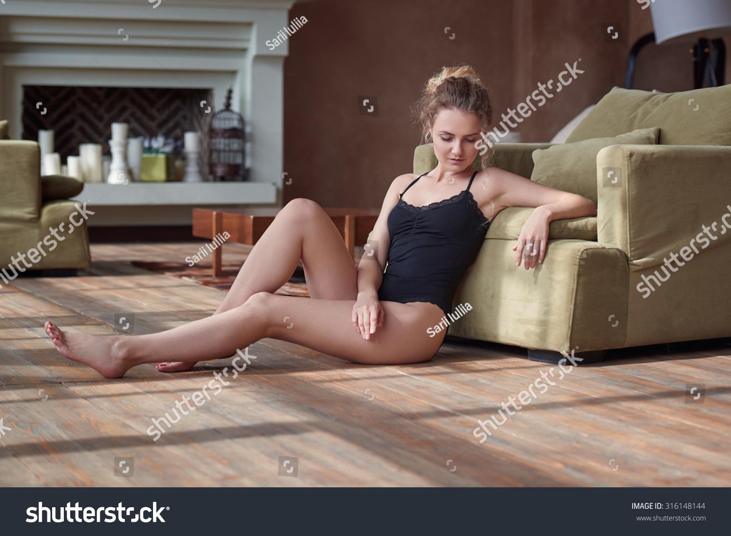 Young Sexy Woman Sitting Stock Photo