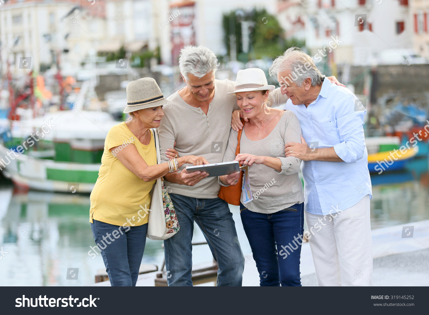 Senior Couples Looking Map On Traveling Stock Photo 319145252 ...