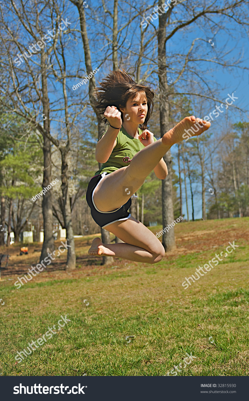 Karate girl Jump Kick stock