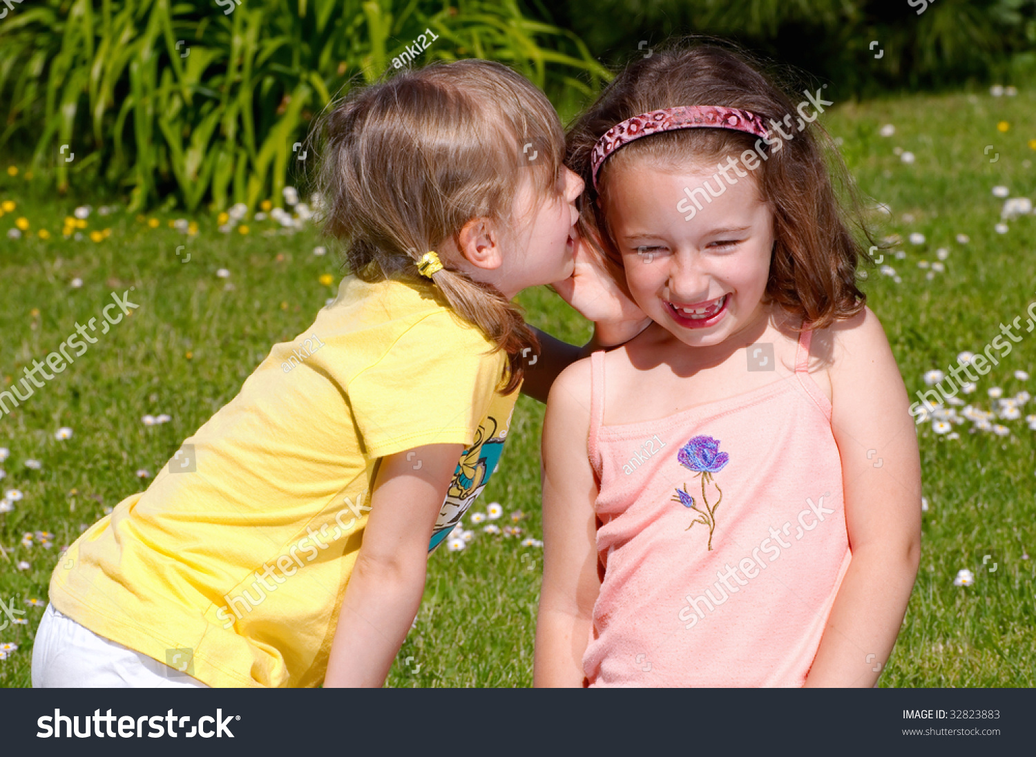 Two Girls Whispering Secrets Each Other Stock Photo 32823883 Shutterstock