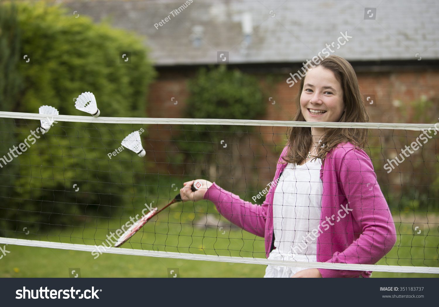 Young Teenage Girl Playing Badminton 스톡 사진 351183737 