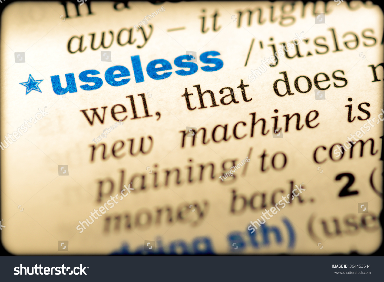 closeup-word-english-dictionary-useless-definition-stock-photo