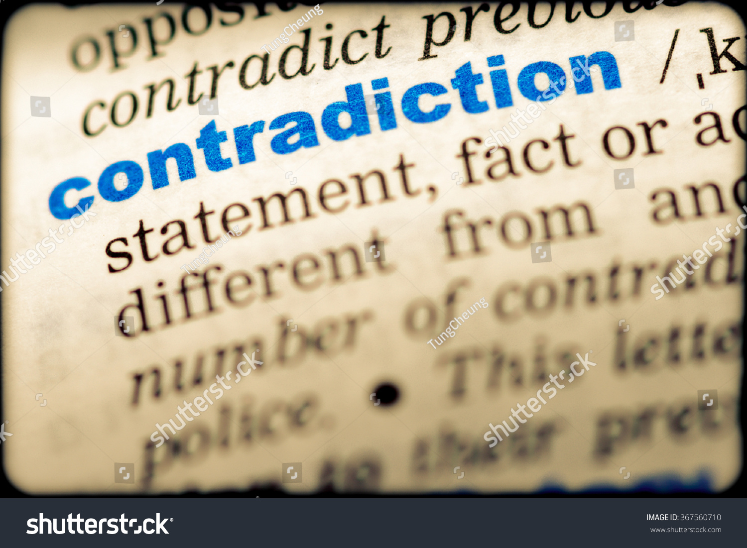 closeup-word-english-dictionary-contradiction-definition-stock-photo