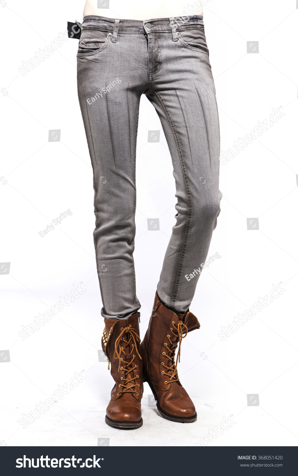 grey pants with brown cowboy boots