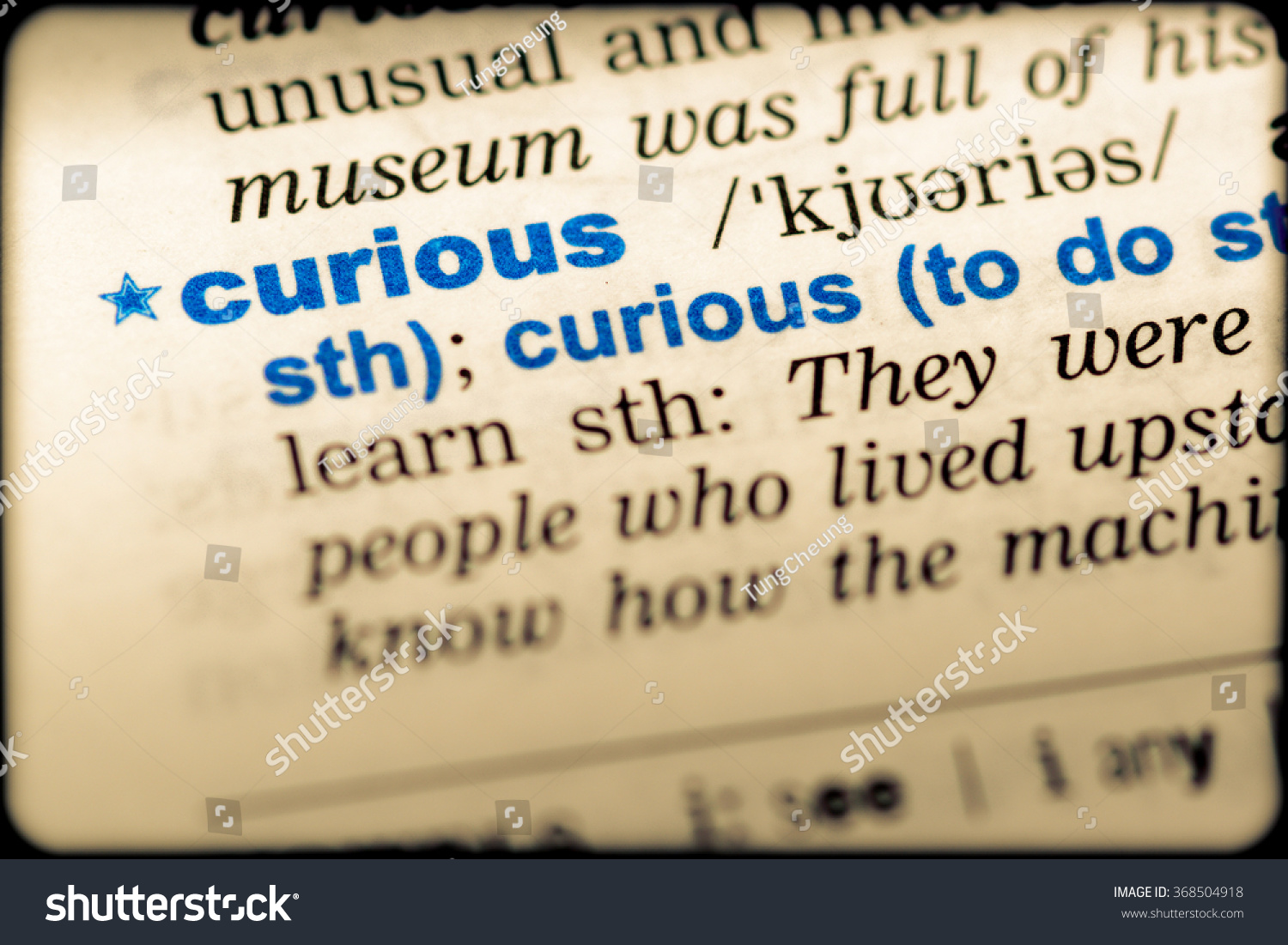 closeup-word-english-dictionary-curious-definition-stock-photo