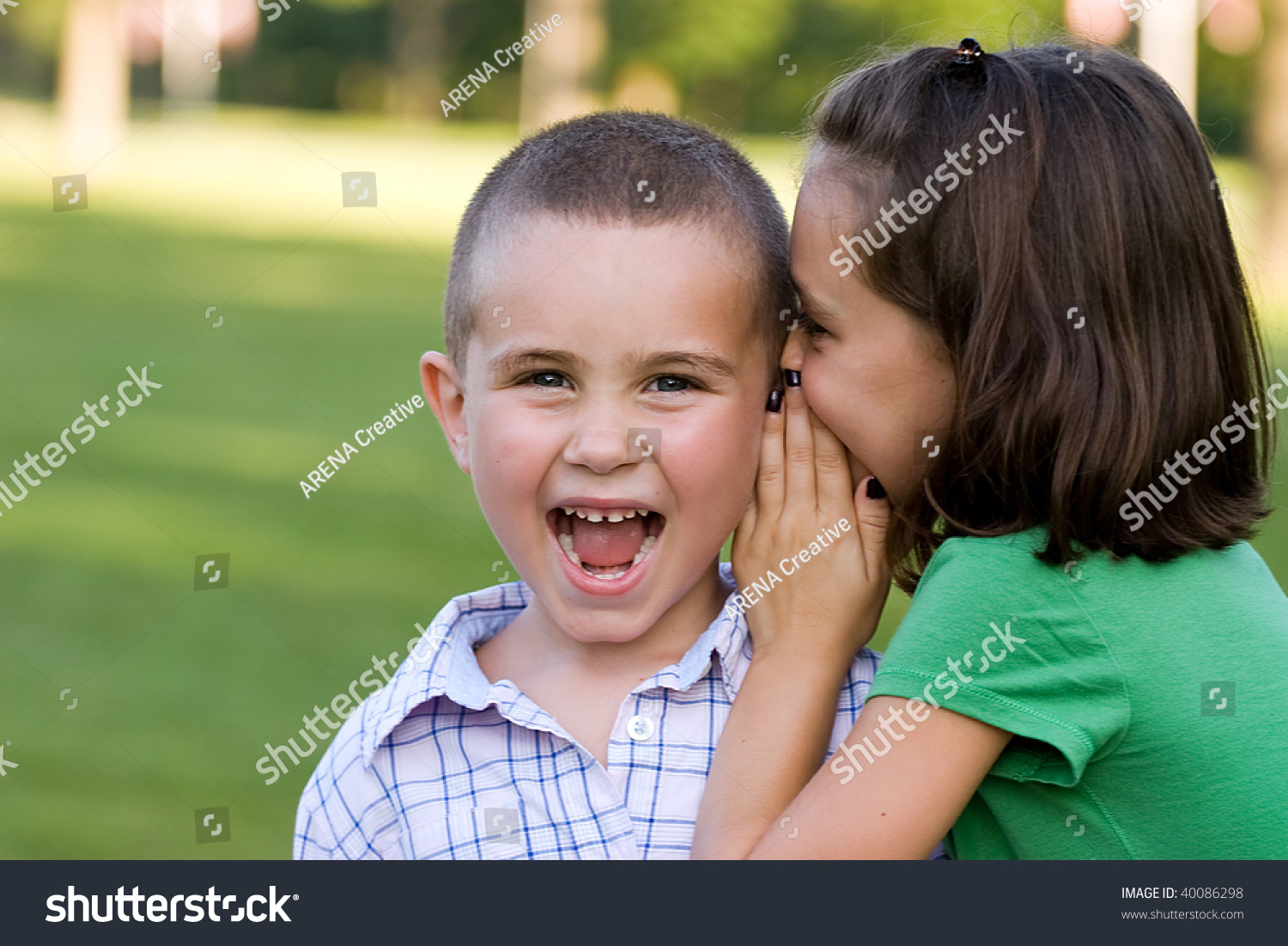 Young Girl Telling Her Brother Secret Stock Photo 40086298 | Shutterstock