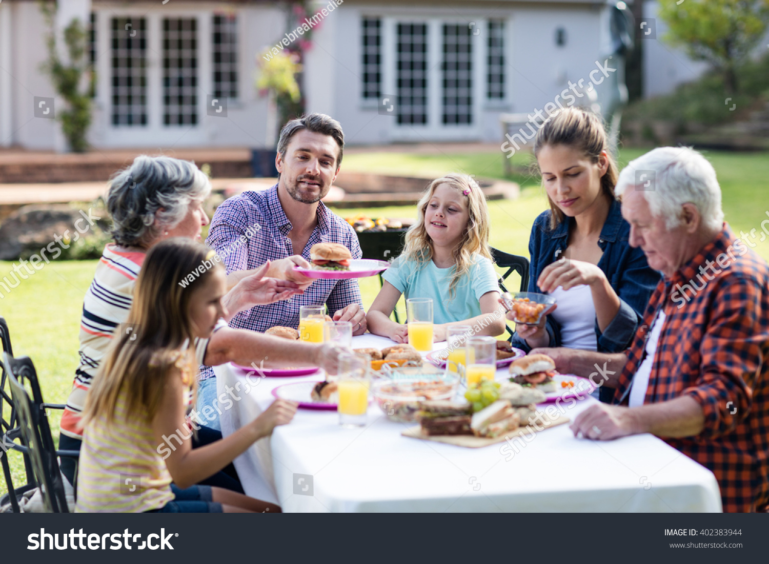 Happy Family Having Lunch Garden On Stock Photo 402383944 | Shutterstock