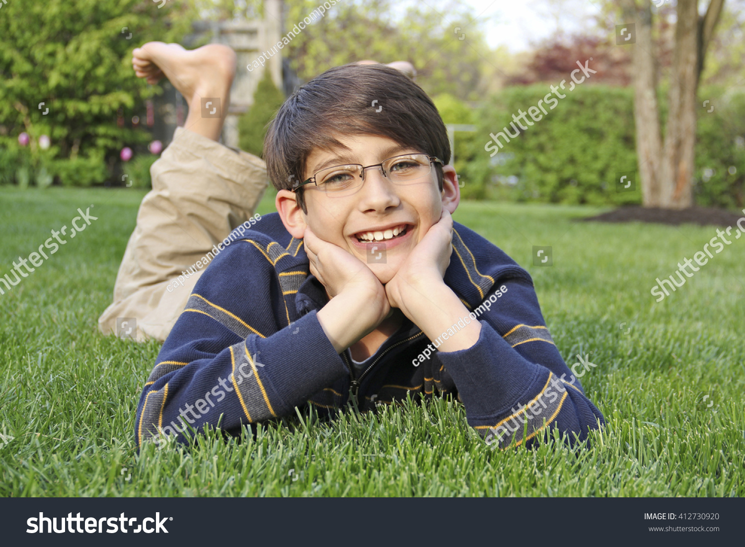 young-elementary-boy-brown-hair-glasses-stock-photo-412730920